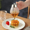 Stilren och Praktisk Honungsdispenser – HoneySaver