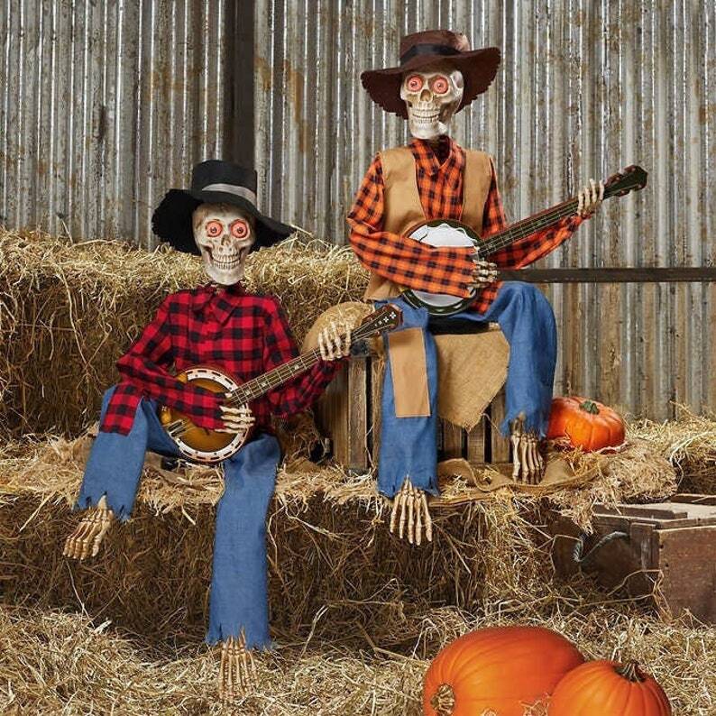 Hauntique Animerad Skelett Duo | Ljudaktiverad Halloween-dekoration med musik och ljus